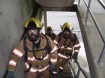 Salem firefighters ascending stairs