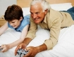 Grandpa and granson playing video games