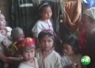 A group of Karen children, who say they were used as porters by soldiers in Burma, gather in a village for refugees in northern Thailand