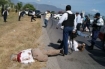 Photos of crime scene pull no punches; body of gubernatorial candidate Rodolfo Torre Cantu lies half on roadway, members of his campaign team lay nearby.