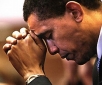 Barack Obama praying