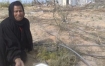 A Palestinian woman near the remains of her home, destroyed by Israel's military.