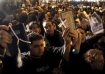 Egyptian Muslims raising the Bible & Quran side by side while forming human shields around a church.