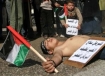 Palestinian children feigning death during a protest against internal fighting in Rafah Refugee Camp