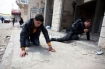 Photo from the Atlantic of an Israeli and Palestinian suffering from Tear Gas in Qalandia 15 May 2011