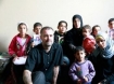 Ken O'Keefe and interpreter Noor Ahmed Harazeen, pose with the Samouni family.