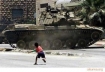 Palestinian boy and tank