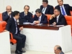 Deputy Turkish Prime Minister Ali Babacan, left-from the back, Foreign Minister Ahmet Davutoglu, second right, and Defense Minister Ismet Yilmaz, right, speak at the parliament during a debate on Turkey-Syria relations, in Ankara. (AFP Photo / Adem Altan)