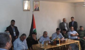 Prime Minister Fayyad is sitting in the middle behind the table