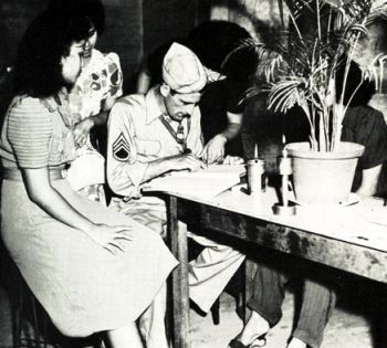 US Army personnel help with routine checking and examination of hostesses and prostitutes during WWII