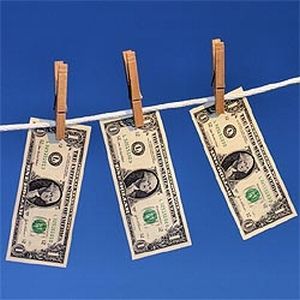 Dollar bills on clothesline