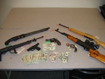 Items police recovered during the arrest, guns cash drugs