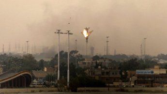 A Libyan jet fighter plunges toward the earth in flames today.