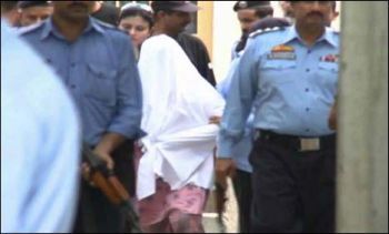 Rimsha being escorted to court