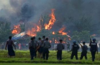 Photo from recent Salem-News article showing Muslim villages being burned and human beings butchered.