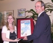 Bill Bradbury receives a literacy award in 2004 from Bonnie King, Statesman Journal`s past NIE Manager.