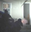 SWAT officers began firing tear gas shells into the building