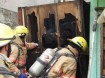 Firefighters working at 4120 Portland Road NE