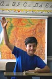 Kid raising hand in class